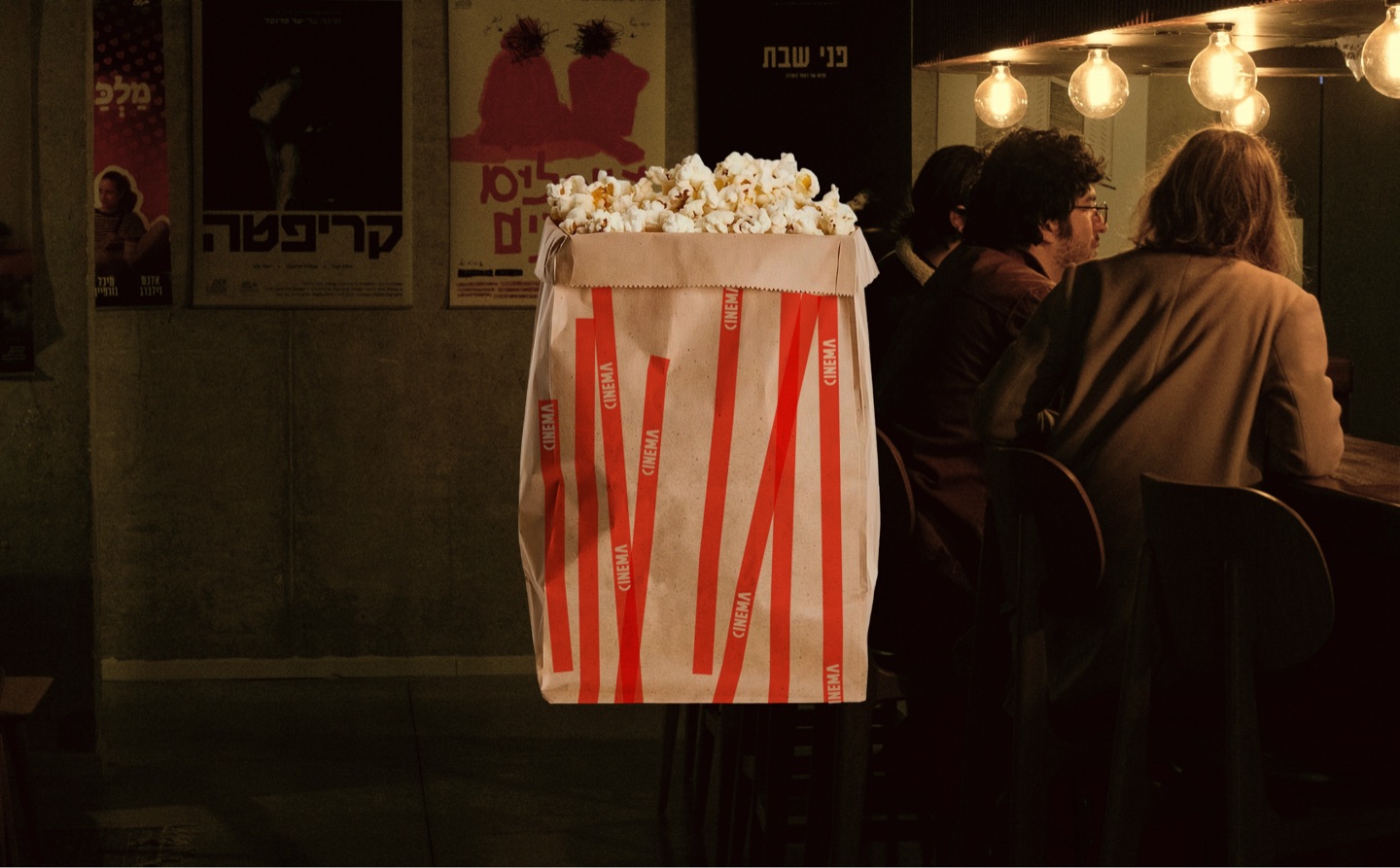 CINEMA popcorn bag at the cinema bar