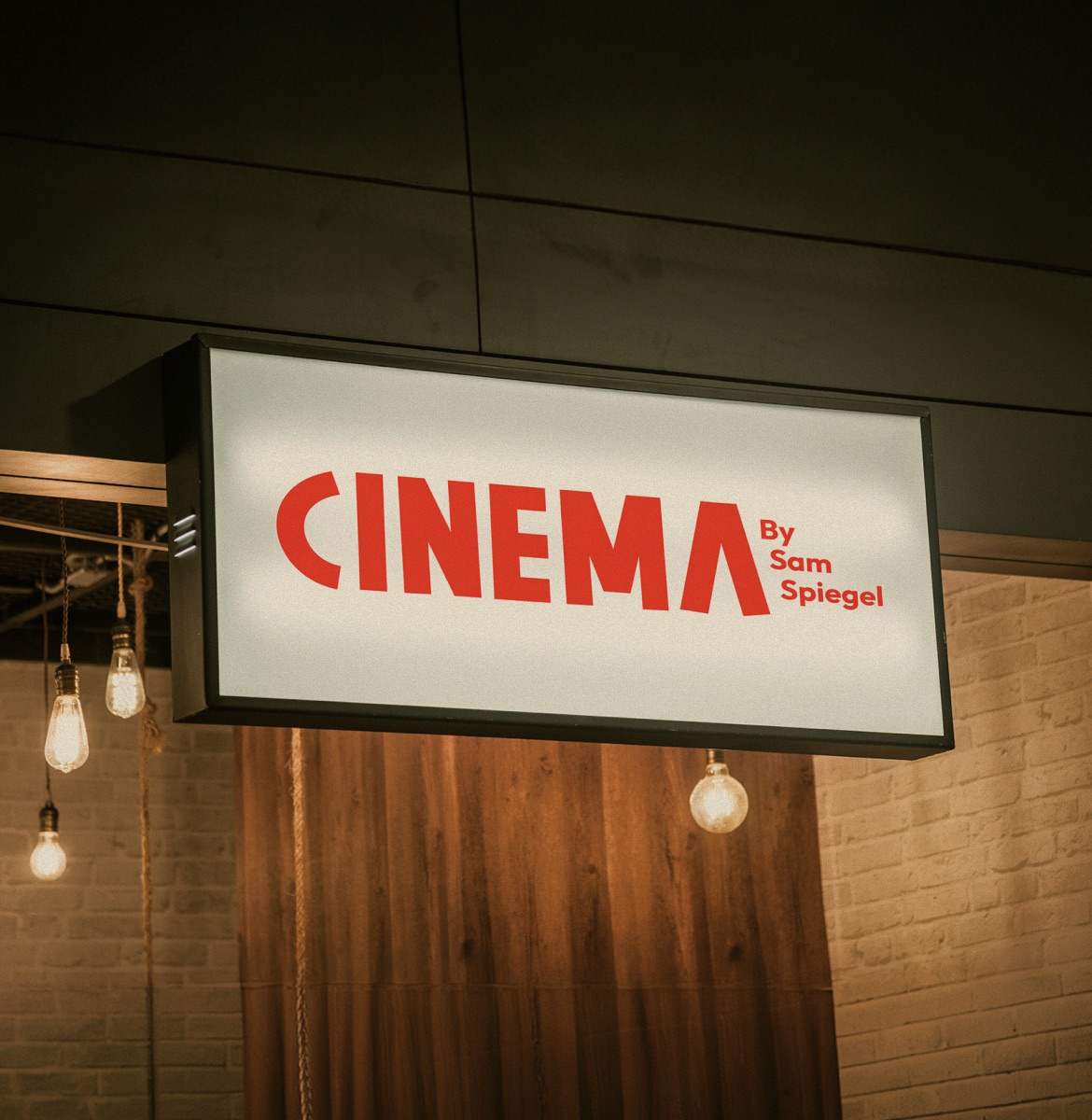 Illuminated CINEMA by Sam Spiegel sign above the bar