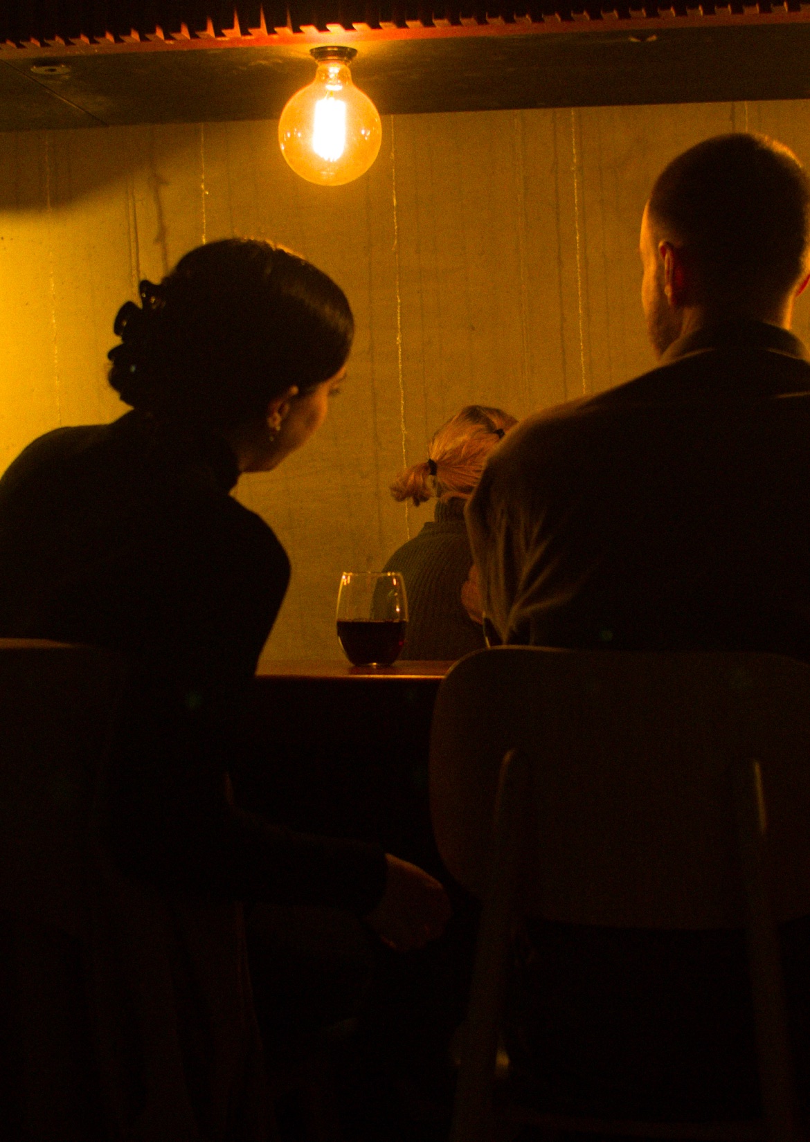 Guests at the cinema bar in warm light